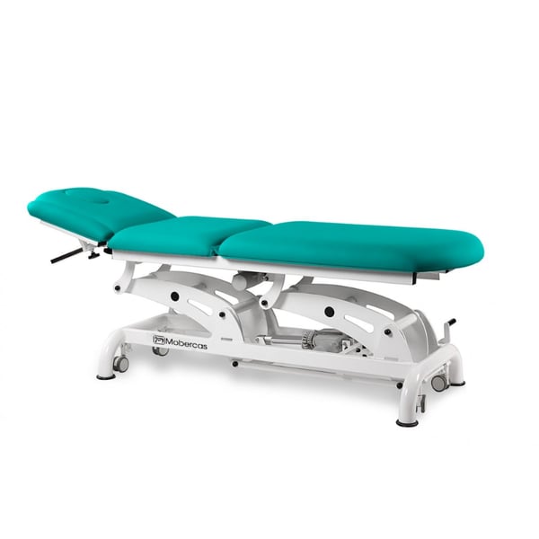 Table de traitement électrique multifonctionnelle pour l'ostéopathie, équipée de 2 moteurs pour le réglage de la hauteur et du repose-pieds par commande manuelle.