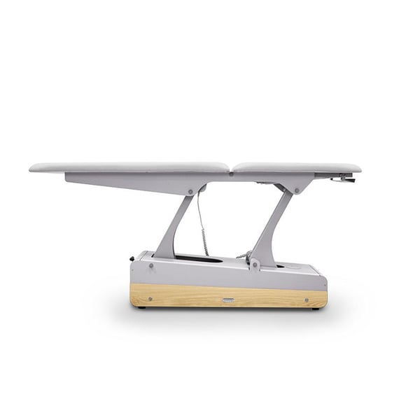 Table de massage électrique SWOP 2L Starter (blanche) : revêtement sans coutures, moteur réglable en hauteur et roulettes rétractables.